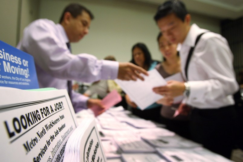 PASADENA, CA - MAY 14:  Job seekers look over job opening fliers at the WorkSource exhibit, a collaborative effort by governmental agencies to offer jobs and job training resources at the Greater Los Angeles Career Expo at the Pasadena Convention Center on May 14, 2009 in Pasadena, California. Nineteen exhibitors offer job and educational opportunities as well as advice from the Board of Equalization at the event that is open to the general public.  (Photo by David McNew/Getty Images)