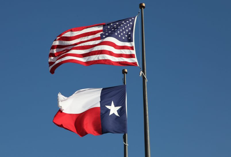 American flag and Texas flag flying at the  LBJ Library in Austin.