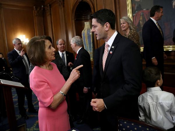 WASHINGTON, DC - DECEMBER 08:  U.S. Speaker of the House Paul Ryan (R) (R-WI) speaks with House Minority Leader Rep. Nancy Pelosi (D-CA) following an event marking the passage of the 21st Century Cures Act at the U.S. Capitol December 8, 2016 in Washington, DC. The bill, passed with strong bipartisan support, provides funding for cancer research, the fight against the epidemic of opioid abuse, mental health treatment, aids the Food and Drug Administration in expediting drug approvals and pushes for better use of technology in medicine.  (Photo by Win McNamee/Getty Images)