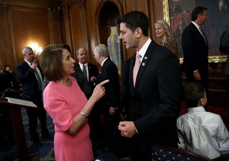 WASHINGTON, DC - DECEMBER 08:  U.S. Speaker of the House Paul Ryan (R) (R-WI) speaks with House Minority Leader Rep. Nancy Pelosi (D-CA) following an event marking the passage of the 21st Century Cures Act at the U.S. Capitol December 8, 2016 in Washington, DC. The bill, passed with strong bipartisan support, provides funding for cancer research, the fight against the epidemic of opioid abuse, mental health treatment, aids the Food and Drug Administration in expediting drug approvals and pushes for better use of technology in medicine.  (Photo by Win McNamee/Getty Images)