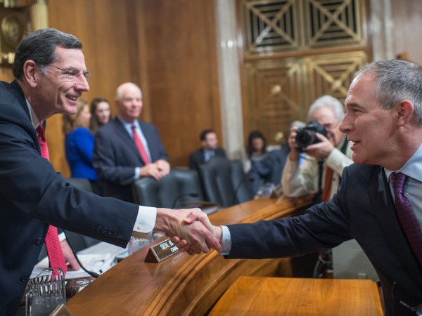 UNITED STATES - JANUARY 18: Chairman John Barrasso, R-Wyo., left, greets Scott Pruitt, President-elect Trump's nominee to be administrator of the Environmental Protection Agency, before his Senate Environment and Public Works Committee confirmation hearing in Dirksen Building, January 18, 2017. (Photo By Tom Williams/CQ Roll Call)