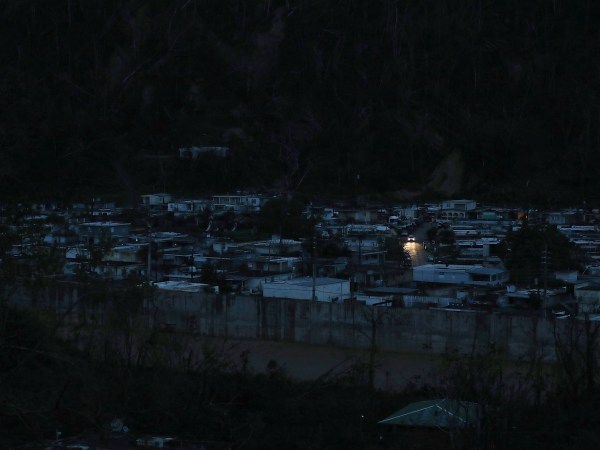 UTUADO, PUERTO RICO - OCTOBER 06:  A car passes among dark homes as people wait for electricity to be restored after Hurricane Maria passed through on October 6, 2017 in Utuado, Puerto Rico.  Puerto Rico experienced widespread damage including most of the electrical, gas and water grid as well as agriculture after Hurricane Maria, a category 4 hurricane, passed through.  (Photo by Joe Raedle/Getty Images)
