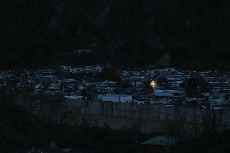 UTUADO, PUERTO RICO - OCTOBER 06:  A car passes among dark homes as people wait for electricity to be restored after Hurricane Maria passed through on October 6, 2017 in Utuado, Puerto Rico.  Puerto Rico experienced widespread damage including most of the electrical, gas and water grid as well as agriculture after Hurricane Maria, a category 4 hurricane, passed through.  (Photo by Joe Raedle/Getty Images)
