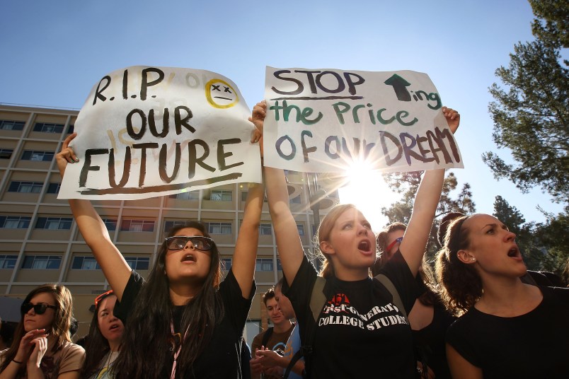 LOS ANGELES, CA - NOVEMBER 19:  University of California Los Angeles (UCLA) students and supporters protest as the UC Board of Regents meets to vote on a 32 percent tuition hike next year on November 19, 2009 in Los Angeles, California. Undergraduate fees for students at the California university system would be paying about $2,500 more. It is the second day that demonstrators, including students from other UC campuses, have gather to try to dissuade the board from approving the proposed increase. Massive cuts to balance the state budget have squeezed education funds in California.   (Photo by David McNew/Getty Images)