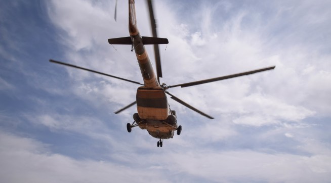 BOLO BLUK (DISTRICT), FARAH, AFGHANISTAN - 2018/03/08: An Mi-17 transport helicopter of the Afghan Air Force approaches for landing on the main road in the desert of Bolo Bluk district, Farah province, Afghanistan (8th of March 2018). The Mi-17 arrived to pick up the bodies of four Commandos that were killed in an operation against the Taliban the night before.Airpower is seen as a decisive advantage of Afghan government forces and their international backers over the insurgency, reaching enemies or own troops in even the remotest areas of the rugged, mountainous and underdeveloped country. These pictures show some of the military aircraft in Afghanistan’s skies – from large transport planes to U.S. drones. (Photo by Franz J. Marty/SOPA Images/LightRocket via Getty Images)
