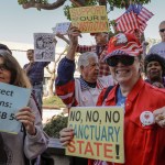 SANTA ANA CA MARCH 27, 2018 --- People opposing SB-54 celebrate. The Orange County Board of Supervisors approved a resolution to condemn the state's sanctuary laws. They also voted to join the Feds in their lawsuit against State of California. (Irfan Khan / Los Angeles Times)