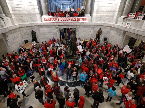 FRANKFORT, KY-APRIL 2: Public school teachers and their supporters protest against a pension reform bill in the rotunda of the Kentucky State Capital April 2, 2018 in Frankfort, Kentucky. The teachers are calling for higher wages and are demanding that Kentucky Gov. Matt Bevin veto a bill that overhauls their pension plan. (Bill Pugliano/Getty Images)