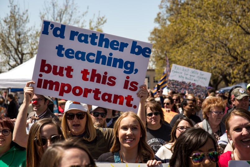 OKLAHOMA CITY, OK - APRIL 04: Thousands gathered and marched in a pitcket line outside the Oklahoma state Capitol building during the third day of a statewide education walkout on April 4, 2018 in Oklahoma City, Oklahoma. Teachers and their supporters are demanding increased school funding and pay raises for school workers. (Photo by Scott Heins/Getty Images)