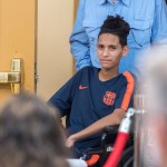Anthony Borges, 15, who was shot five times on February 14th in the Marjory Stoneman Douglas massacre, is helped into a news conference by his grandfather at the Sheraton Suites Plantation on Friday, April 6, 2018, in Plantation, Fla. Still recovering after he used his body as a human shield to protect the lives of his fellow classmates, he was not able to speak during the conference. (Jennifer Lett/Sun Sentinel/TNS)