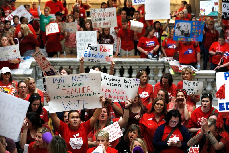 FRANKFORT, KY-APRIL 13: Kentucky Public school teachers protest outside the Kentucky House Chamber as they rally for a "day of action" at the Kentucky State Capitol to try to pressure legislators to override Kentucky Governor Matt Bevin's recent veto of the state's tax and budget bills April 13, 2018 in Frankfort, Kentucky. The teachers also oppose a controversial pension reform bill which Gov. Bevin signed into law. (Photo by Bill Pugliano/Getty Images)