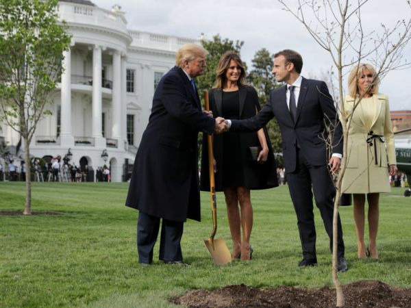 WASHINGTON, DC - APRIL 23:  U.S. President Donald Trump, U.S. first lady Melania Trump, French President Emmanuel Macron and his wife Brigitte Macron participate in a tree-planting ceremony on the South Lawn of the White House April 23, 2018 in Washington, DC. The European Sessile Oak is a gift from the Macrons and comes from Belleau Woods, where more than 9,000 American marines died in June 1918 during the First World War. According to the first lady's office "The forest is a memorial site and important symbol of the sacrifice the United States made to ensure peace and stability in Europe." (Photo by Chip Somodevilla/Getty Images)