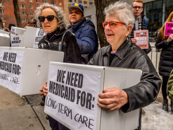 NYC FEDERAL BUILDING AT 26 FEDERAL PLAZA, NEW YORK, NY, UNITED STATES - 2017/03/21: Protesters holding boxes with a print on it. Outside the NYC Federal Building (26 Federal Plaza, Bway between Worth and Duane), which contains Medicaid offices, hundreds of New Yorkers who rely on Medicaid, including seniors and people with disabilities, will conduct political theater to protest congressional Republicans' plan to remake Medicaid. (Photo by Erik McGregor/Pacific Press/LightRocket via Getty Images)