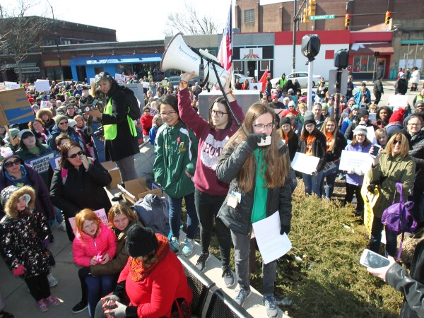 Meredith Gallagher, 15, of Cuyahoga Falls, the organizer of the Akron March for Our Lives event to end gun violence, yells into the microphone as she leads a rally at Highland Square in Akron, Ohio, on Saturday, March 24, 2018. (Karen Schiely/Akron Beacon Journal/TNS)