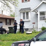 Fort Dodge Police officers Matt Weir, left, Larry Hedlund and Jacob Naatz investigate an accidental shooting, Wednesday, May 9, 2018, in Fort Dodge, Iowa. Richard Remme, of Fort Dodge, told police he was playing with his dog, Balew, on the couch and tossed the dog off his lap. He says when the pit bull-Labrador mix bounded back up, he must have disabled the safety on the gun in his belly band and stepped on the trigger causing the gun to fire and strike Remme in the leg. (Joe Sutter/The Messenger via AP)