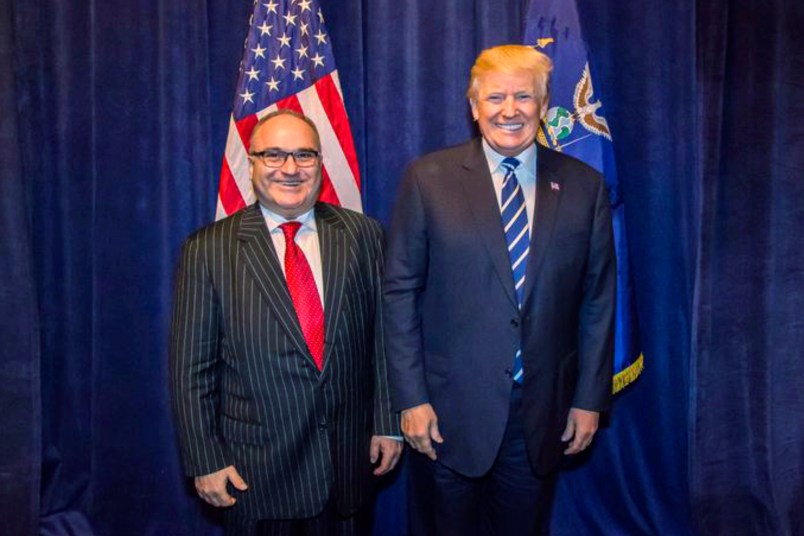 **HOLD FOR STORY TO MOVE OVERNIGHT. WDC WILL ADVISE TIMING** This photo acquired by The Associated Press is copied from a leaked email sent by Elliott Broidy and shows George Nader posing for a photo with President Donald Trump back stage at an RNC fund raiser in Dallas on Oct. 25, 2017. (AP Photo)