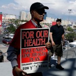 Culinary Union members file into a university arena to vote on whether to authorize a strike Tuesday, May 22, 2018, in Las Vegas. (AP Photo/Isaac Brekken)