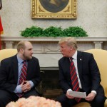 President Donald Trump, right, talks with Joshua Holt, who was recently released from a prison in Venezuela, in the Oval Office of the White House, Saturday, May 26, 2018, in Washington. (AP Photo/Alex Brandon)