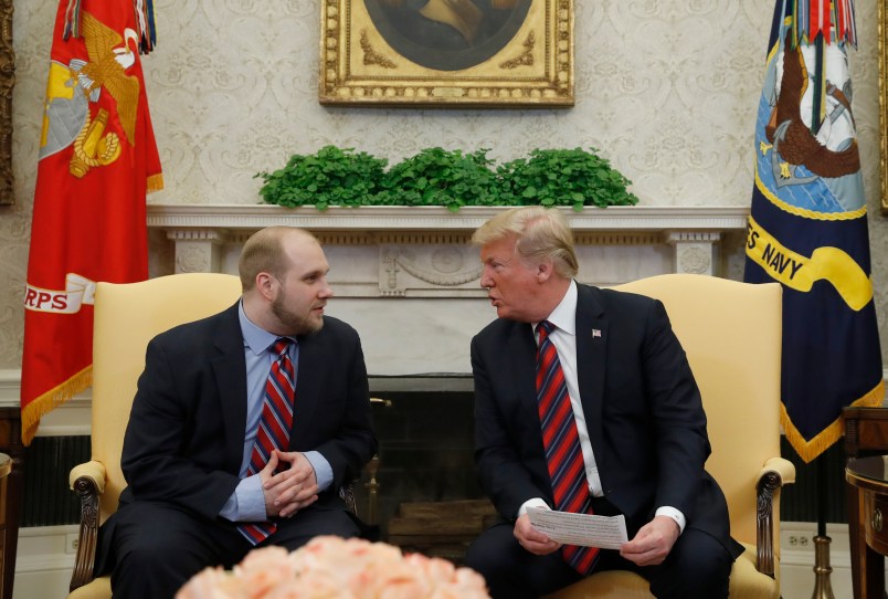 President Donald Trump, right, talks with Joshua Holt, who was recently released from a prison in Venezuela, in the Oval Office of the White House, Saturday, May 26, 2018, in Washington. (AP Photo/Alex Brandon)