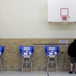 Bowling Green, OH  - NOVEMBER 6: A man casts his ballot using an electronic voting machine November 6, 2012 at an elementary school in Bowling Green, Ohio. Voting is underway in the US presidential election in the battleground state of Ohio. (Photo by J.D. Pooley/Getty Images)