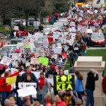 Thousands of Kentucky school teachers marched Monday, April 2, 2018 from the Kentucky Education Association's headquarters to the State Capitol in Frankfort, Ky. to protest legislative changes to their pensions and education cuts. Public schools in all 120 Kentucky counties were closed Monday, either to join in the protest or because of spring break. (Charles Bertram/Lexington Herald-Leader/TNS)