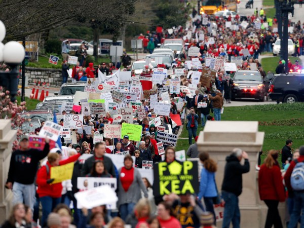 Thousands of Kentucky school teachers marched Monday, April 2, 2018 from the Kentucky Education Association's headquarters to the State Capitol in Frankfort, Ky. to protest legislative changes to their pensions and education cuts. Public schools in all 120 Kentucky counties were closed Monday, either to join in the protest or because of spring break. (Charles Bertram/Lexington Herald-Leader/TNS)