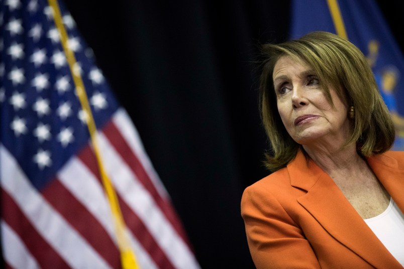 NEW YORK, NY - MAY 1: House Minority Leader Nancy Pelosi (D-CA) looks on during a bill signing event at John Jay College, May 1, 2018 in New York City. New York Governor Andrew Cuomo signed a bill ensuring domestic abusers are prohibited from possessing handguns and long guns in New York State. The bill also prohibits anyone with an outstanding warrant, felony, or other serious offenses from receiving or renewing a firearm license. (Photo by Drew Angerer/Getty Images)