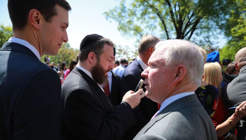 U.S. President Donald Trump signs an executive order during an event in the Rose Garden to mark the National Day of Prayer at the White House May 3, 2018 in Washington, DC. The White House invited leaders from varios faiths and religions to participate in the day of prayer, which was designated in 1952 by the United States Congress to ask people "to turn to God in prayer and meditation."