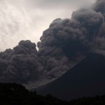 Volcan de Fuego, or Volcano of Fire, blows outs a thick cloud of ash, as seen from Alotenango, Guatemala, Sunday, June 3, 2018. One of Central America's most active volcanos erupted in fiery explosions of ash and molten rock Sunday, killing people and injuring many others while a towering cloud of smoke blanketed nearby villages in heavy ash. (AP Photo/Santiago Billy)