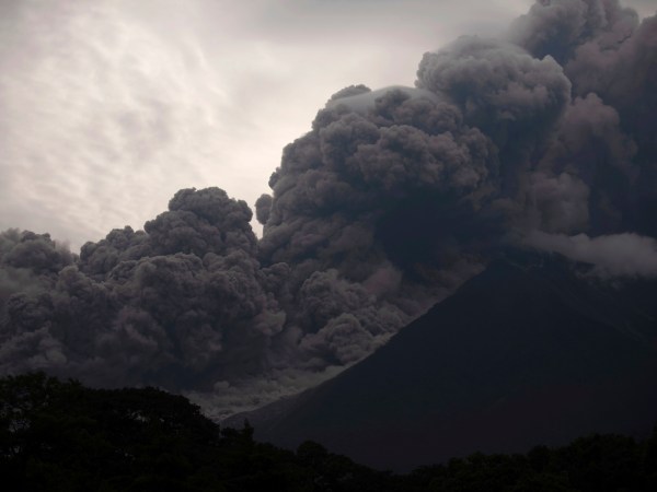 Volcan de Fuego, or Volcano of Fire, blows outs a thick cloud of ash, as seen from Alotenango, Guatemala, Sunday, June 3, 2018. One of Central America's most active volcanos erupted in fiery explosions of ash and molten rock Sunday, killing people and injuring many others while a towering cloud of smoke blanketed nearby villages in heavy ash. (AP Photo/Santiago Billy)