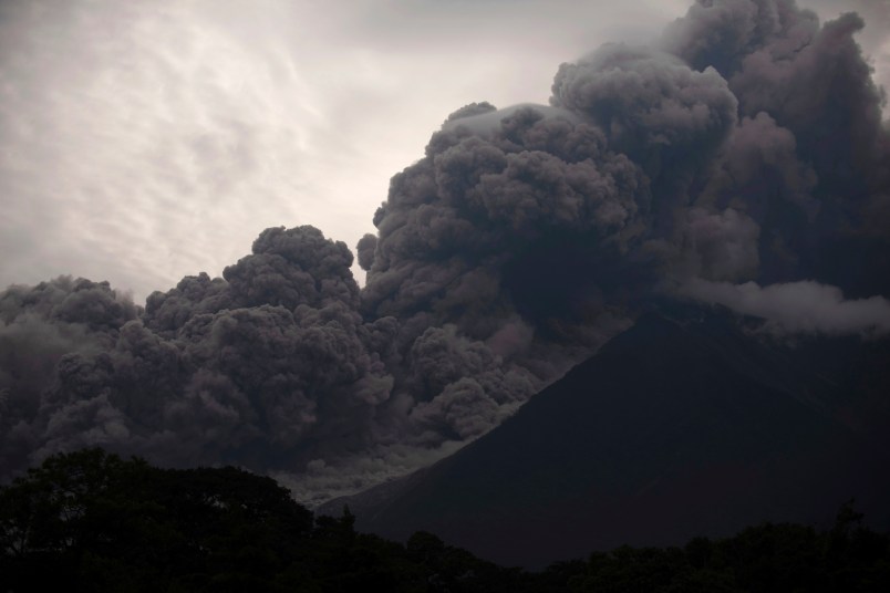 Volcan de Fuego, or Volcano of Fire, blows outs a thick cloud of ash, as seen from Alotenango, Guatemala, Sunday, June 3, 2018. One of Central America's most active volcanos erupted in fiery explosions of ash and molten rock Sunday, killing people and injuring many others while a towering cloud of smoke blanketed nearby villages in heavy ash. (AP Photo/Santiago Billy)