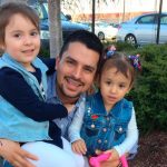 In this undated family photo provided by Sandra Chica, Pablo Villavicencio poses with his two daughters, Luciana, left, and Antonia. After Villavicencio couldn't produce a New York State Driver's License for identification, a guard at the Fort Hamilton in the Brooklyn borough of New York called Immigration and Customs Enforcement on him as he tried to deliver a pizza to the military base. Villavicencio was detained by military police and handed over to ICE pending removal from the country. (Villavicencio Family Photo via AP) .