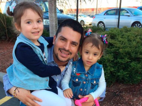 In this undated family photo provided by Sandra Chica, Pablo Villavicencio poses with his two daughters, Luciana, left, and Antonia. After Villavicencio couldn't produce a New York State Driver's License for identification, a guard at the Fort Hamilton in the Brooklyn borough of New York called Immigration and Customs Enforcement on him as he tried to deliver a pizza to the military base. Villavicencio was detained by military police and handed over to ICE pending removal from the country. (Villavicencio Family Photo via AP) .
