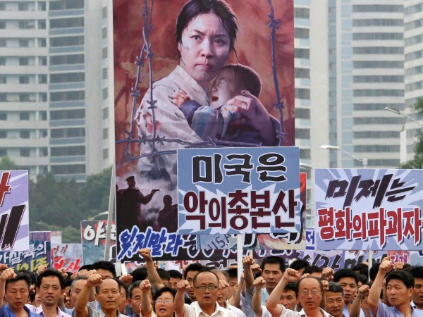 Tens of thousands of men and women pump their fists in the air and chant as they carry placards with anti-American propaganda slogans at Pyongyang's central Kim Il Sung Square on Sunday, June 25, 2017, in North Korea, to mark what North Korea calls "the day of struggle against U.S. imperialism" – the anniversary of the start of the Korean War. (AP Photo/Jon Chol Jin)