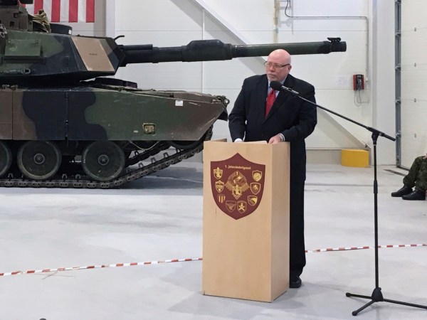 U.S. Ambassador to Estonia James D. Melville Jr. addresses dignitaries in front of an U.S. Army tank, at a hand-over ceremony of the upgraded NATO military base in Tapa, Estonia, Thursday, Dec. 15, 2016. The U.S. military has completed infrastructure investments worth $11.2 million to upgrade the Estonian army base as a part of a U.S. commitment to the alliance's eastern flank, which is facing increasing tensions with Russia. (AP Photo/Vitnija Saldava)