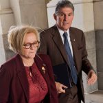 UNITED STATES - DECEMBER 13: Sen. Claire McCaskill, D-Mo., and Joe Manchin, D-W.Va., arrives to the Senate carriage entrance of the Capitol for votes on Saturday, December 13, 2014. (Photo By Tom Williams/CQ Roll Call)