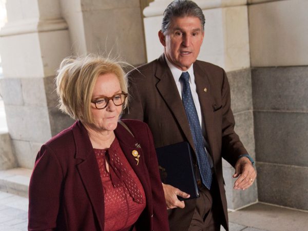 UNITED STATES - DECEMBER 13: Sen. Claire McCaskill, D-Mo., and Joe Manchin, D-W.Va., arrives to the Senate carriage entrance of the Capitol for votes on Saturday, December 13, 2014. (Photo By Tom Williams/CQ Roll Call)