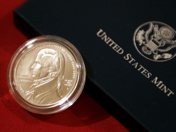 WASHINGTON - MAY 4: Supreme Court Justice Stephen Breyer; Henrietta Fore, director of the U.S. Mint; and Frank Jones, president of the Supreme Court Historical Society hold a ceremony to unveil the Chief Justice John Marshall Silver Dollar, May 4, 2005 at the Supreme Court Upper Great Hall in Washington, DC. The new silver dollar commemorates the 250th anniversary of Marshall's birthday, Sept. 24, 1755, and it is the first coin produced by the U.S. Mint honoring a Supreme Court Justice. (Photo by Chip Somodevilla/Getty Images)