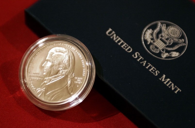 WASHINGTON - MAY 4: Supreme Court Justice Stephen Breyer; Henrietta Fore, director of the U.S. Mint; and Frank Jones, president of the Supreme Court Historical Society hold a ceremony to unveil the Chief Justice John Marshall Silver Dollar, May 4, 2005 at the Supreme Court Upper Great Hall in Washington, DC. The new silver dollar commemorates the 250th anniversary of Marshall's birthday, Sept. 24, 1755, and it is the first coin produced by the U.S. Mint honoring a Supreme Court Justice. (Photo by Chip Somodevilla/Getty Images)