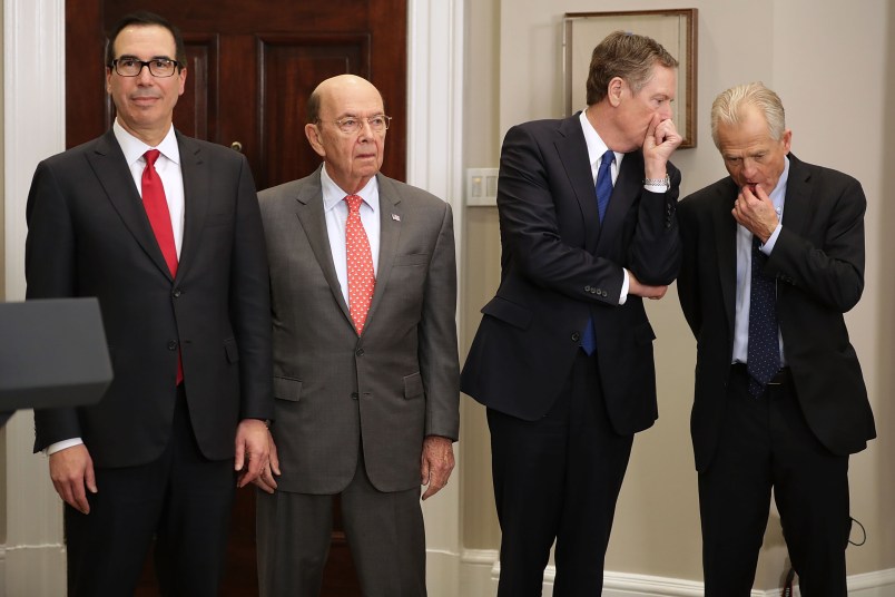 U.S. President Donald Trump signs the 'Section 232 Proclamations' on steel and aluinum imports in Roosevelt Room the the White House March 8, 2018 in Washington, DC. Trump announced a week earlier that he will put a 25-percent tarriff on steel and a 10-percent tarriff on alumninum.