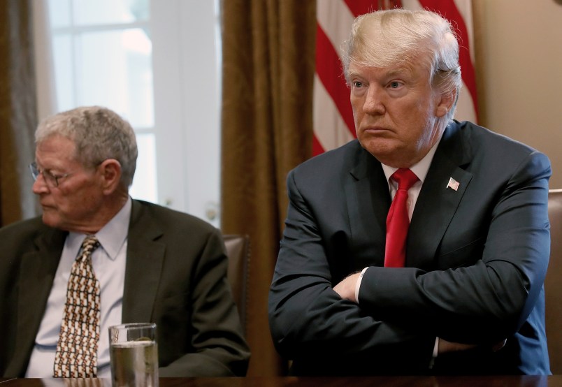 WASHINGTON, DC - JUNE 20:  U.S. President Donald Trump (R) meets with members of the U.S. Congress on immigration in the Cabinet Room of the White House June 20, 2018 in Washington, DC. Trump said he would sign an executive order later today relating to the issue of immigrant children being separated from their parents while being detained. Also pictured is Sen. James Inhofe (L) (R-OK). (Photo by Win McNamee/Getty Images)