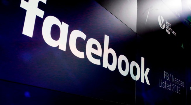 The logo for Facebook appears on screens at the Nasdaq MarketSite, in New York's Times Square,  Thursday, March 29, 2018. (AP Photo/Richard Drew)