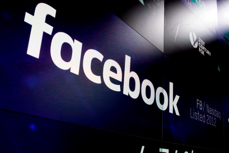 The logo for Facebook appears on screens at the Nasdaq MarketSite, in New York's Times Square,  Thursday, March 29, 2018. (AP Photo/Richard Drew)