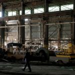 GRANITE CITY, IL - JULY 26: A Secret Service agent walks through a steel coil warehouse before President Donald Trump's visit on July 26, 2018 at U.S. Steel's Granite City Works plant in Granite City, Illinois. (Photo by Whitney Curtis/Getty Images)