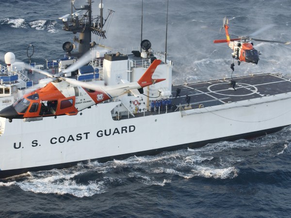 Under the watchful eye of a U.S. Coast Guard Helicopter Interceptor Squadron helo, a Coast Guard maritime security force practices fast-roping to the Coast Guard cutter Seneca's flight deck eight miles south of Rockaway, N.Y. Aug. 28, 2004. Armed U.S. Coast Guard helicopters are conducting security patrols over New York City during the Republican National Convention. USCG Photo/Mike Hvozda
