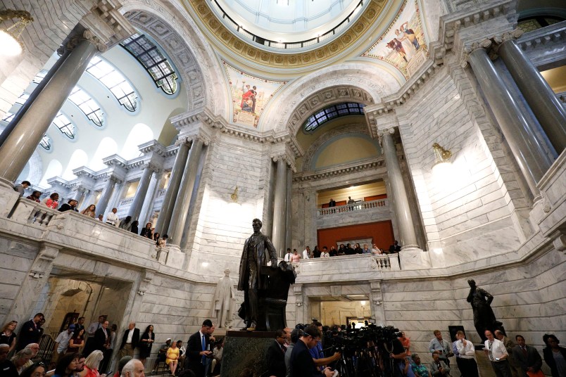 FRANKFORT, KY-AUGUST 30: African-American groups hold a rally at the Kentucky State Capitol building to urge Kentucky Governor Matt Bevin to remove a statue of Confederate President Jefferson Davis from the State Capitol rotunda August 30, 2017 in Frankfort Kentucky.  (Photo by Bill Pugliano/Getty Images)