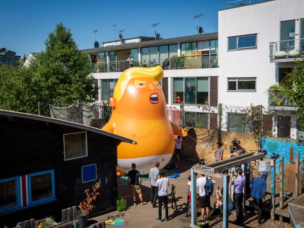 The Trump Baby sitting team give the six metre high inflatable TrumpBaby his first London outing inside the disused North London playground, Islington, London, United Kingdom. 26th June 2018. The plan, is to fly him above Parliament Square in Westminster when the real Trump, president of the United States arrives in the United Kingdom on the 13th of July 2018.  (photo by Andrew Aitchison / In pictures via Getty Images)
