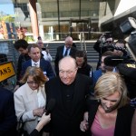 NOTE; THIS IS A COURT PICTURE. CHECK ID BEFORE USE - Archbishop Philip Wilson (old bald man, centre) - a Magistrate gives his judgement about whether or not he is guilty of concealing child sexual abuse. Newcastle Court, Newcastle.