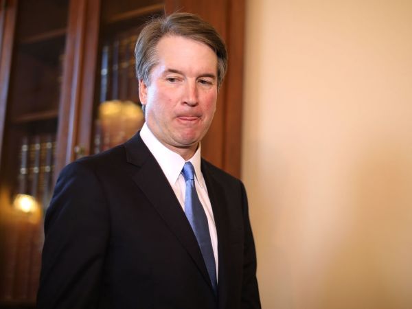 Judge Brett Kavanaugh poses for photographs with Vice President Mike Pence and Senate Majority Leader Mitch McConnell (R-KY) before a meeting in McConnell's office in the U.S. Capitol July 10, 2018 in Washington, DC. U.S. President Donald Trump nominated Kavanaugh to succeed retiring Supreme Court Associate Justice Anthony Kennedy.