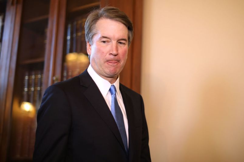 Judge Brett Kavanaugh poses for photographs with Vice President Mike Pence and Senate Majority Leader Mitch McConnell (R-KY) before a meeting in McConnell's office in the U.S. Capitol July 10, 2018 in Washington, DC. U.S. President Donald Trump nominated Kavanaugh to succeed retiring Supreme Court Associate Justice Anthony Kennedy.