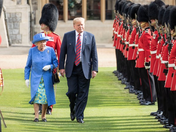 The Queen walks with President Trump as they inspect the Coldstream guards at Windsor castle.